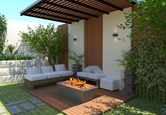 Sala de terraza con mesa de fuego 